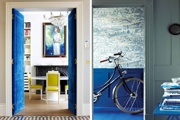 Dazzling blue velvet doors, printed wall paper and blue floors.