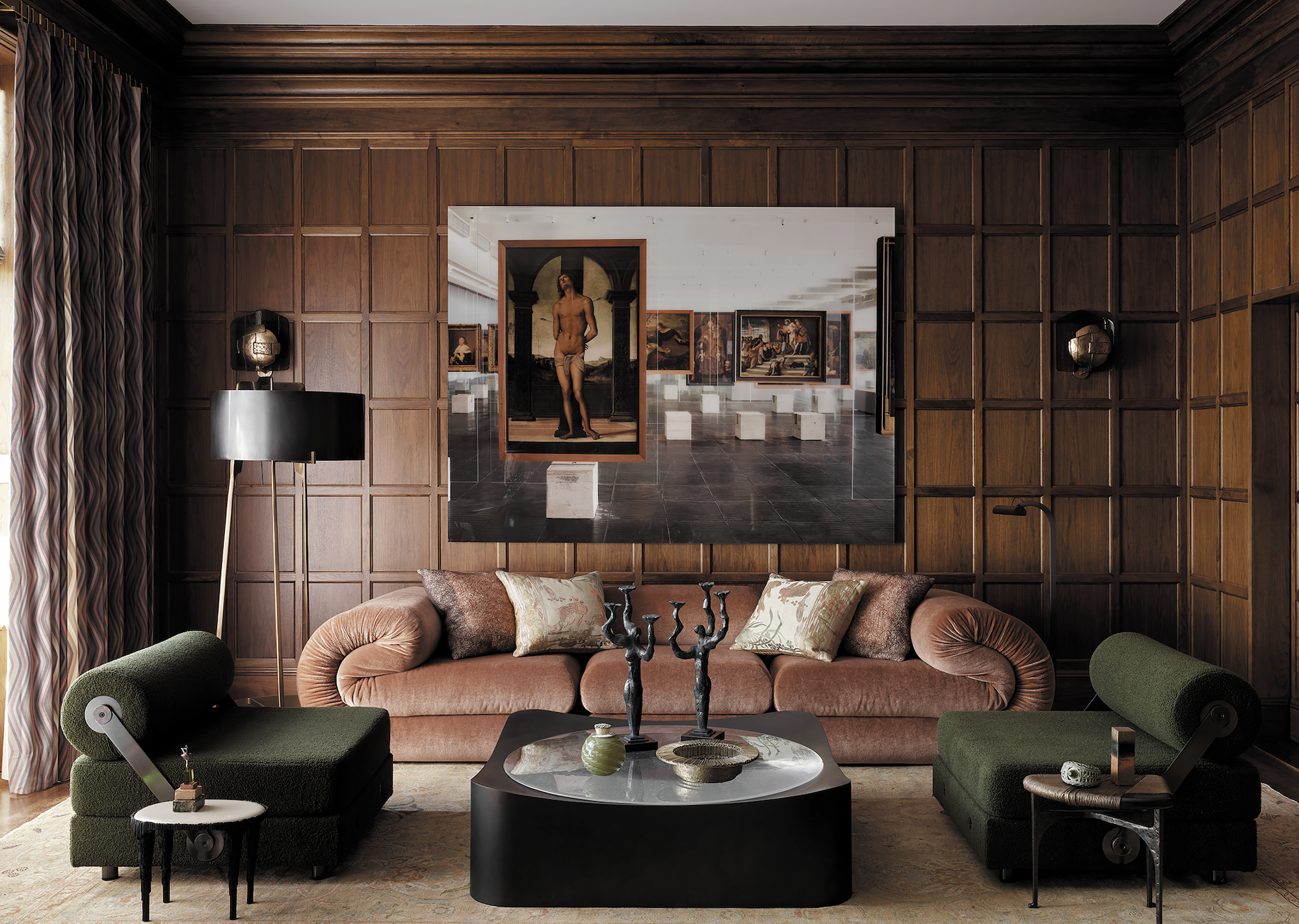 The Fold sofa by John Pomp Studios and a pair of Devon sconces by Caste Design were sourced from De Sousa Hughes. The green Todo Modo chairs are by Jean-Michel Wilmotte (1993), and the art above the sofa is Sem Começo Nem Fim / Without Beginning or End by Sir Isaac Julien, found at Jessica Silverman Gallery.