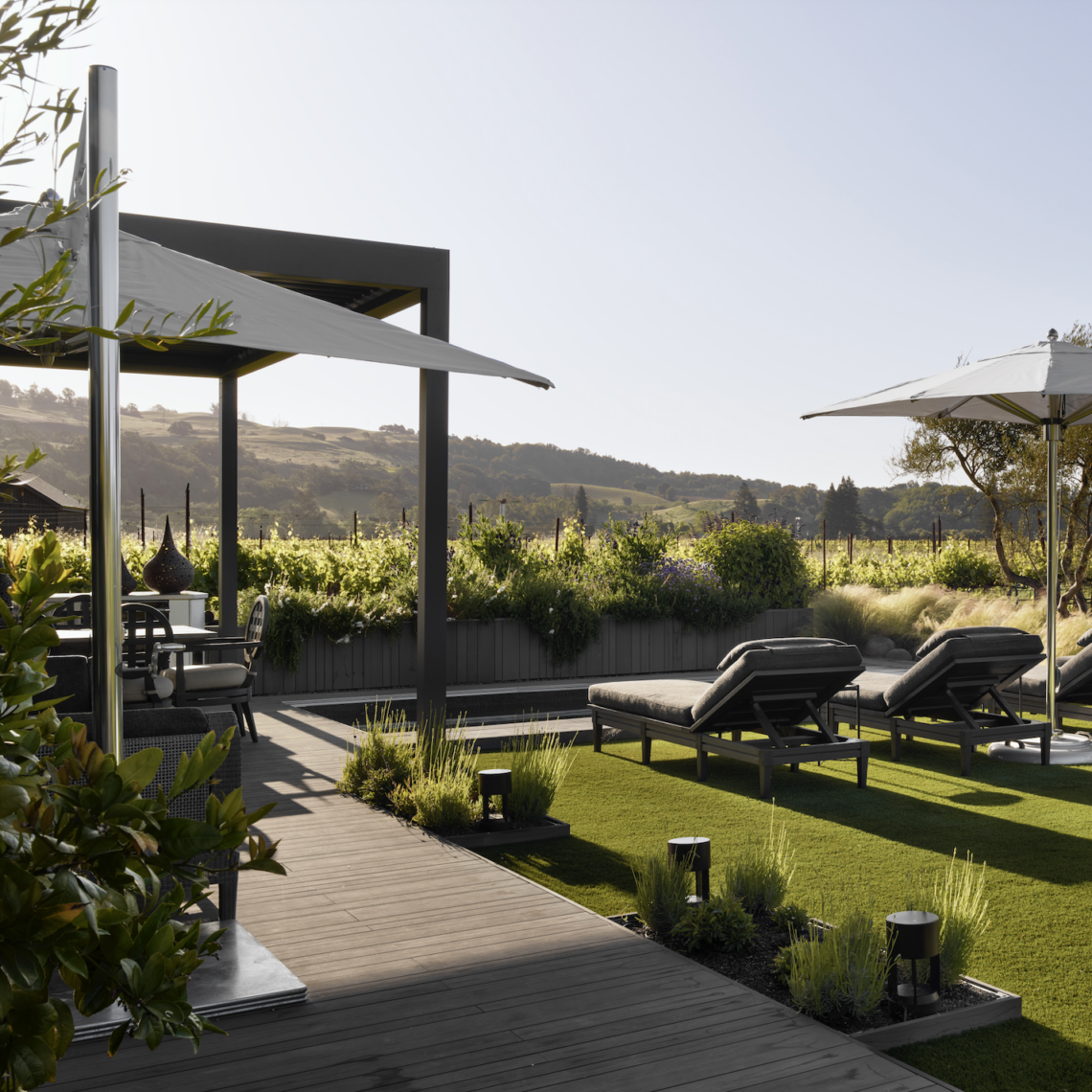 McGuire chaise lounges and Tuuci umbrellas enhance the experience of enjoying vineyard views. Photo by Jose Manuel Alorda.